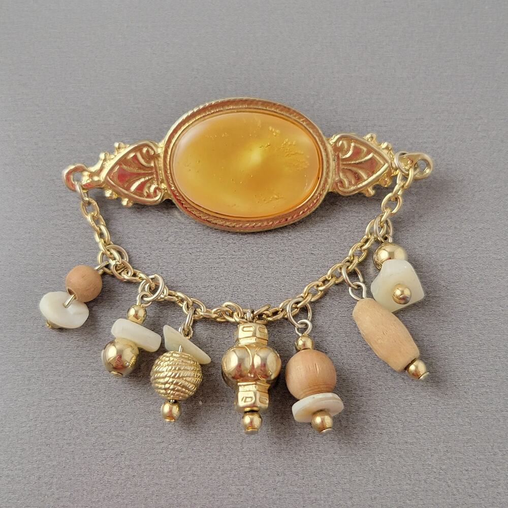 Vintage Gold Tone Oval Brooch with Dangling Beads and Chain Design
